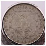 1880 Morgan Silver Dollar w/ Clip Attached