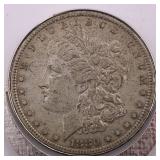 1880 Morgan Silver Dollar w/ Clip Attached