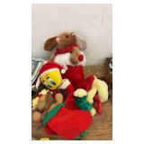 Assorted Holiday Decorations Including Figurines and Plush Toys