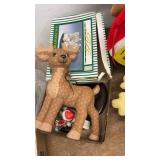 Assorted Holiday Decorations Including Figurines and Plush Toys