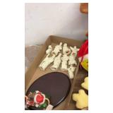 Assorted Holiday Decorations Including Figurines and Plush Toys