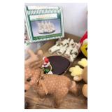 Assorted Holiday Decorations Including Figurines and Plush Toys