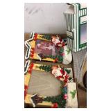 Assorted Holiday Decorations Including Figurines and Plush Toys