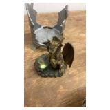 Collection of Dragon and Skull Themed Figurines and Decor