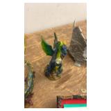 Collection of Dragon and Skull Themed Figurines and Decor