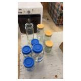 Collection of 8 Glass Storage Jars with Wooden and Blue Lids