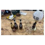 Collection of Glass Bottles, Animal-Themed Lamp, and Decorative Glassware