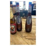 Collection of Glass Bottles, Animal-Themed Lamp, and Decorative Glassware