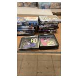 Collection of DVDs Featuring Music, Comedy, and Films