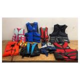 Lot of 9 Various Life Jackets and Personal Flotation Devices