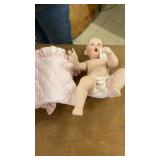 Collection of Porcelain Dolls and Decorative Masks