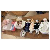 Collection of Porcelain Dolls and Decorative Masks