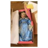 Collection of Porcelain Dolls and Decorative Masks