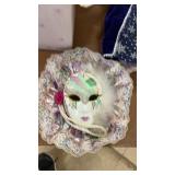 Collection of Porcelain Dolls and Decorative Masks