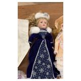 Collection of Porcelain Dolls and Decorative Masks