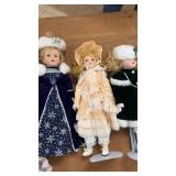 Collection of Porcelain Dolls and Decorative Masks