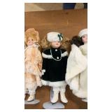 Collection of Porcelain Dolls and Decorative Masks