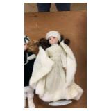 Collection of Porcelain Dolls and Decorative Masks