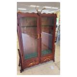 Vintage Wooden Display Cabinet with Antler Accents and Glass Doors
