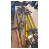 Collection of Assorted Hand Tools Including Shovels, Pickaxes, and More
