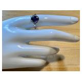 Elegant Silver Ring with Large Gemstone and Accent Stones