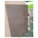 Three Large Pegboards Framed Behind