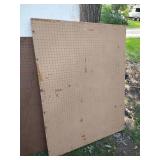 Three Large Pegboards Framed Behind