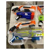 TABLE FULL OF NERF GUNS