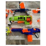 TABLE FULL OF NERF GUNS