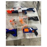 TABLE FULL OF NERF GUNS