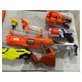 TABLE FULL OF NERF & RIVAL GUNS
