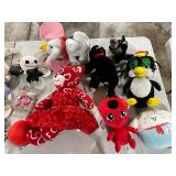 TABLE FULL OF STUFFED ANIMALS