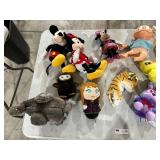 TABLE FULL OF STUFFED ANIMALS