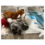 TABLE FULL OF STUFFED ANIMALS