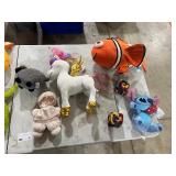 TABLE FULL OF STUFFED ANIMALS