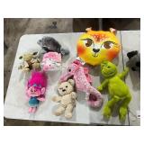 TABLE FULL OF STUFFED ANIMALS