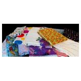 Large Bin of Children Themed Fabric Remnants in Bright Patterns