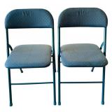 Two Blue Metal Folding Chairs