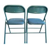 Two Blue Metal Folding Chairs