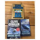 6 Clive Cussler books, 3 soft cover books, 3 hardcover our treasure of KHAN, mirage, Valhalla rising, soft cover, Arctic drift, blue gold, the sea hunters