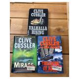 6 Clive Cussler books, 3 soft cover books, 3 hardcover our treasure of KHAN, mirage, Valhalla rising, soft cover, Arctic drift, blue gold, the sea hunters