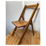 1940s wood slat folding chair stands 32 inches tall, 16 inches wide, all original brass hardware