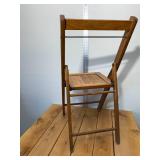 1940s wood slat folding chair stands 32 inches tall, 16 inches wide, all original brass hardware