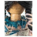 14 inch doll hand crocheted dress with bead and silver toe embellishments tall is made in China one081. Comes with doll stand.