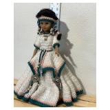 14 inch doll hand crocheted dress with bead and silver toe embellishments tall is made in China one081. Comes with doll stand.