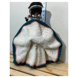 14 inch doll hand crocheted dress with bead and silver toe embellishments tall is made in China one081. Comes with doll stand.