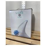 Three new inbox Luxe items, compact steam iron, handheld garment steamer, and three tiered laundry cart.