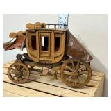 Handmade wooden stage coach, approximately 14 inches long 9 inches high if I had to guess I would say the 1970s