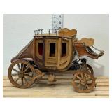 Handmade wooden stage coach, approximately 14 inches long 9 inches high if I had to guess I would say the 1970s