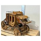 Handmade wooden stage coach, approximately 14 inches long 9 inches high if I had to guess I would say the 1970s